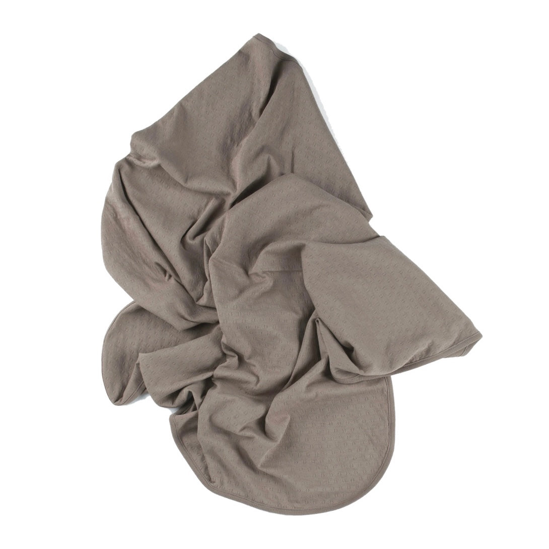 brown pointelle ribbed knit double layered essential swaddle blanket. 33" x 33". 100% organic cotton.