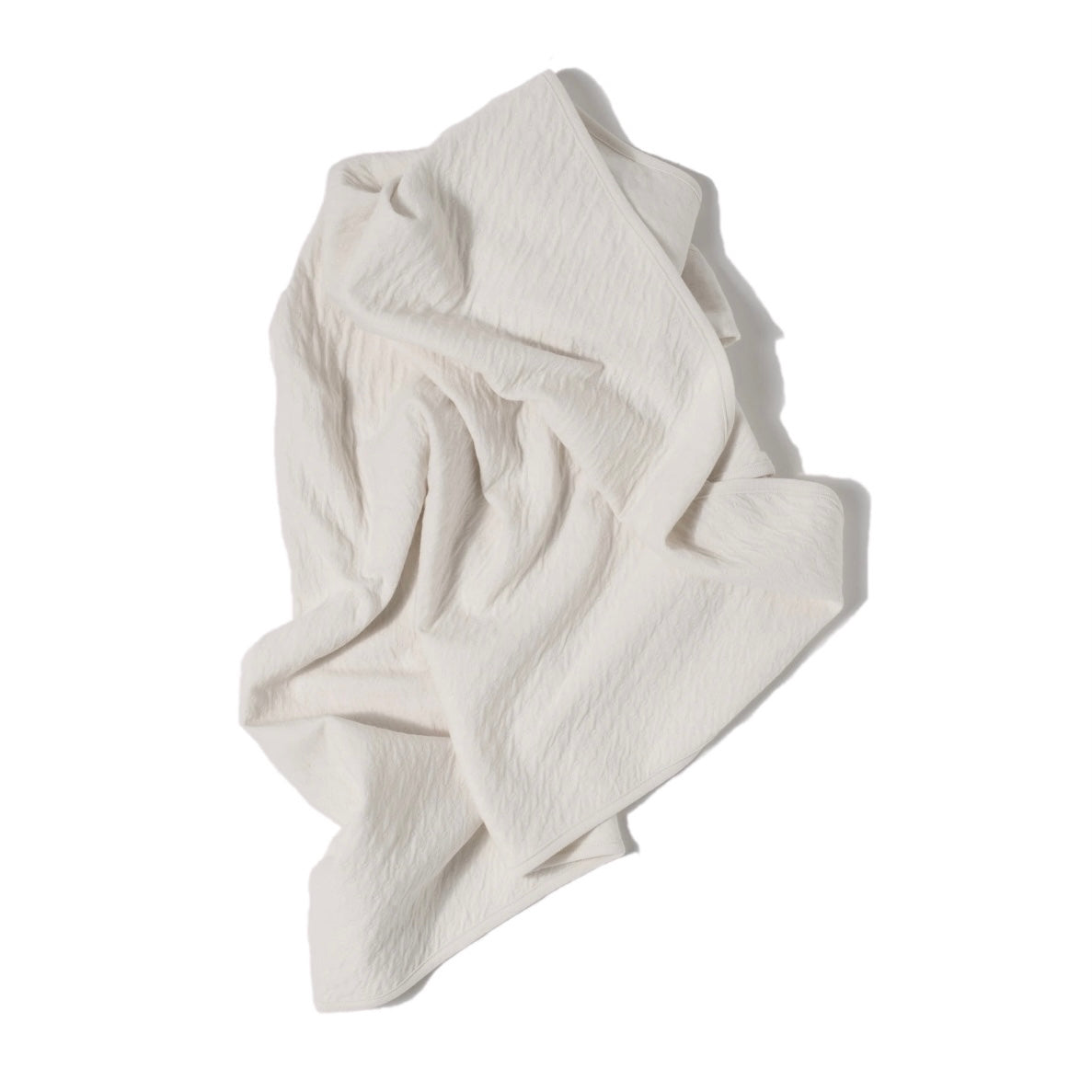 cream color pointelle ribbed knit double layered essential swaddle blanket. 33" x 33". 100% organic cotton.